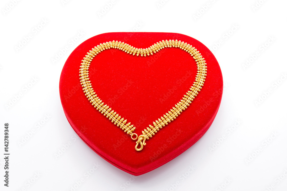 Golden Necklace on Red Heart Box Golden Necklace on Red Heart Box