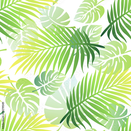 Tropical seamless pattern with palm tree leaves and exotic plant