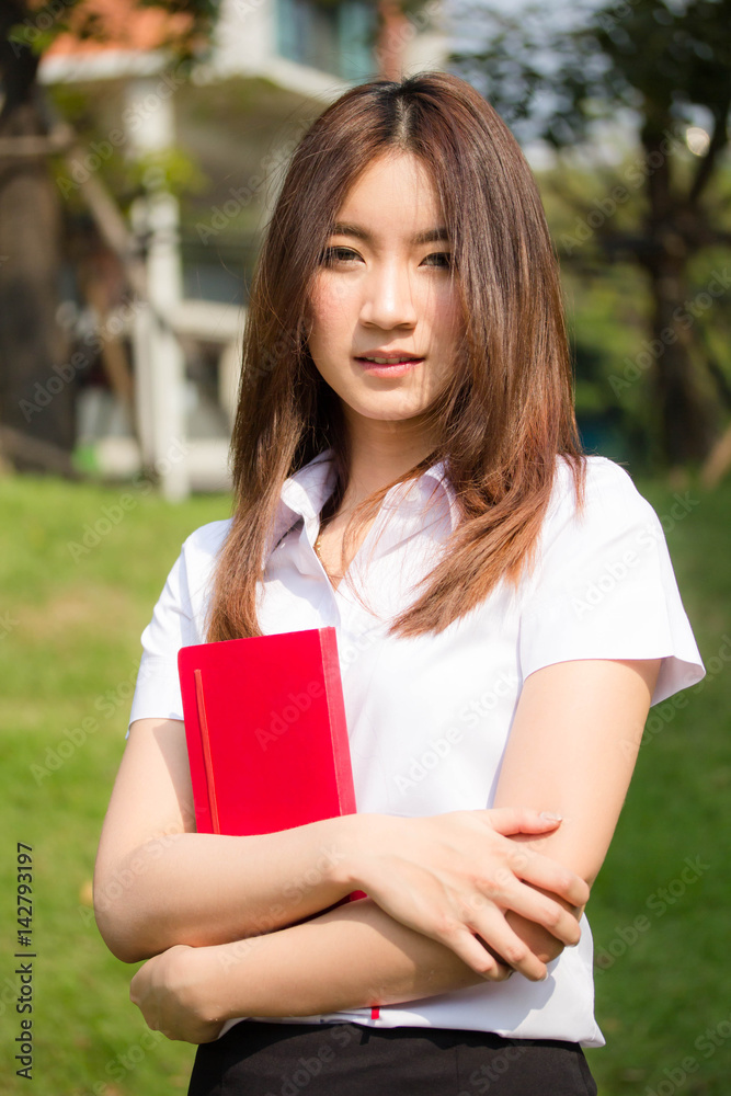 Portrait of thai adult student university uniform beautiful girl relax and smile Portrait of thai adult student university uniform beautiful girl relax and smile