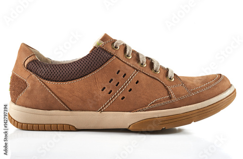 Men's shoe front view. Brown leather sneakers isolated on white background. photo