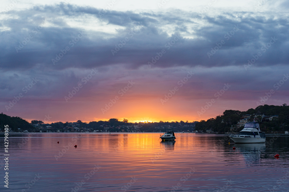 Sunset, sunrise landscape with yachts on tropical lagoon