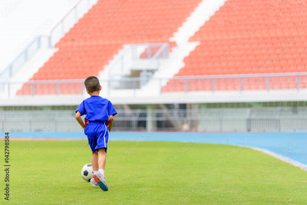 Fototapeta premium Boy play football