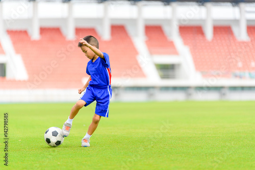Boy play football © TinPong