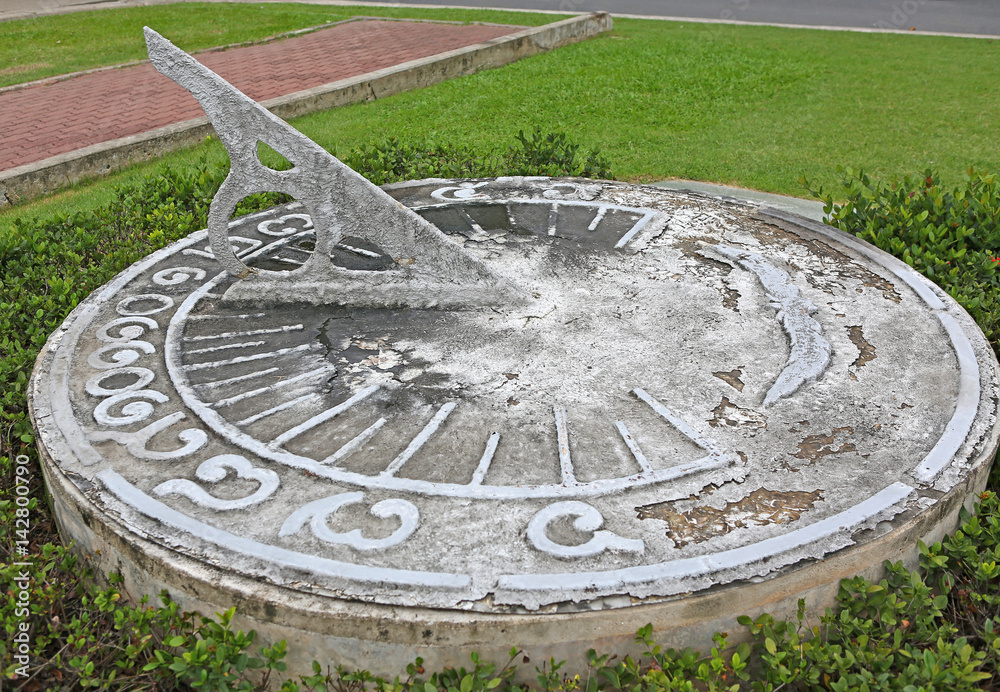 antique sundial decorating a garden
