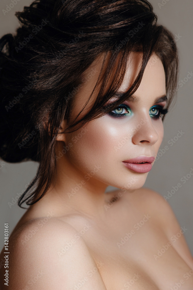 Beautiful, tender, sexy brunette Girl with long hair and puffy lips with makeup, creating on a gray background. Soft focus, space for text Beautiful, tender, sexy brunette Girl with long hair and puffy lips with makeup, creating on a gray background. Soft focus, space for text