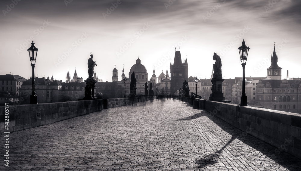 Panoramic monochrome view of Charles bridge in long exposure, Prague