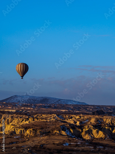 Hot air balloons flying over the mountain in Cappadocia Goreme National Park Turkey