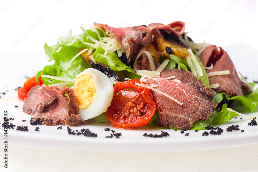 meat salad with roast beef, mushrooms, vegetables and cheese on white background, isolated