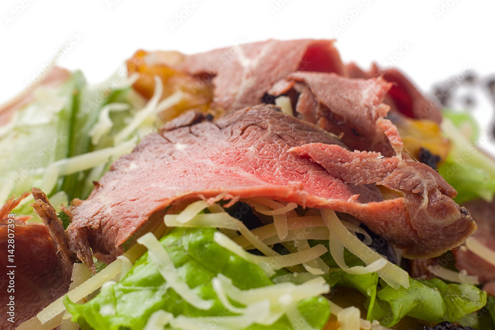 meat salad with roast beef, mushrooms, vegetables and cheese on white background, isolated