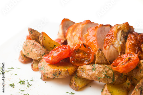 grilled chicken with a crispy crust, with BBQ sauce and baked potatoes with dill, on a white background