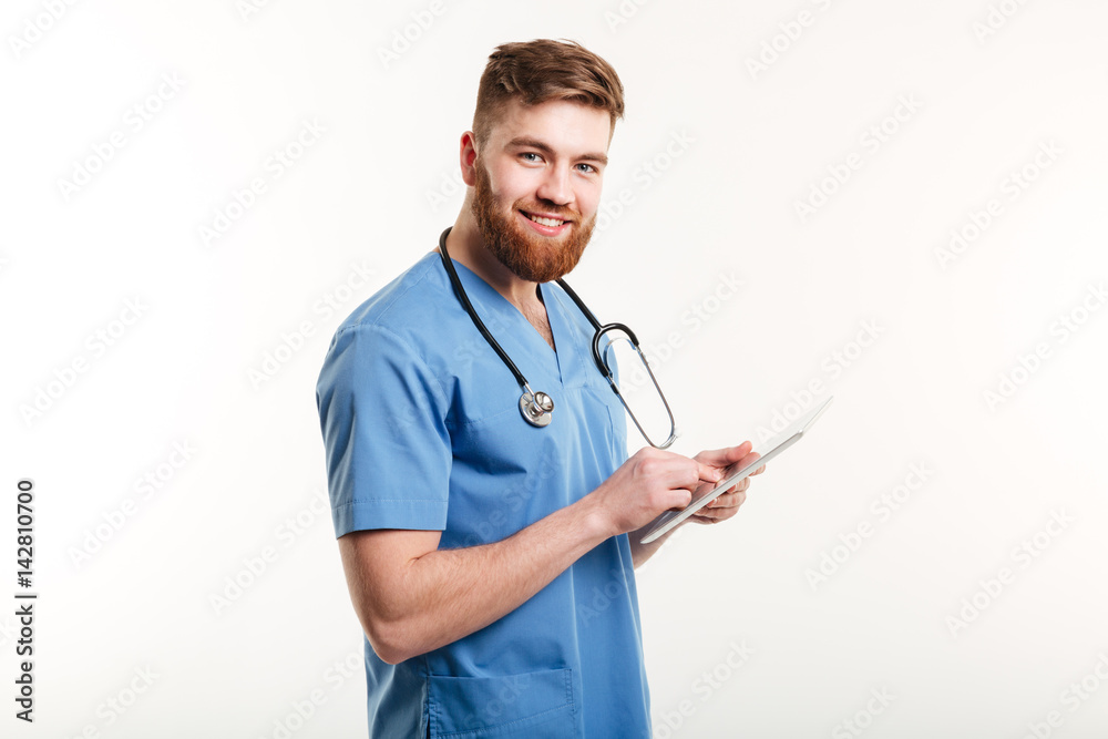 Portrait of a cheerful smiling medical doctor or nurse Portrait of a cheerful smiling medical doctor or nurse