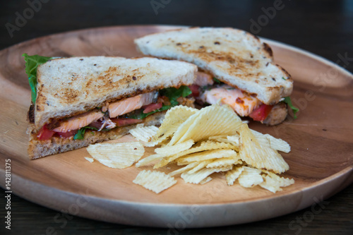  sandwich closeup with  tomatoes chip potato