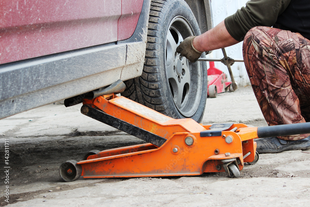 installation of passenger car wheel and replacement on spring tire. installation of passenger car wheel and replacement on spring tire.