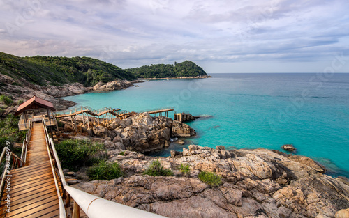 Concrete stairs and walk way leading down to the "broken pier" in an paradise empty bay on Perhentian Kecil, Malaysia.