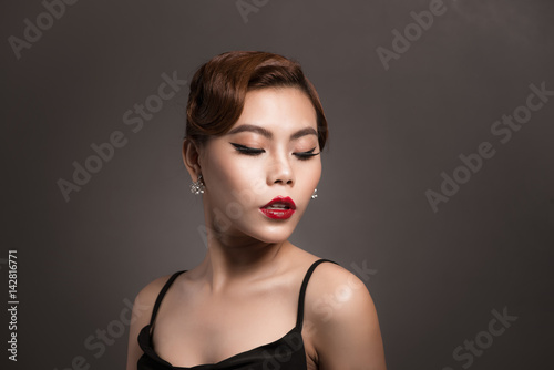 Portrait of a beautiful young woman with brown hair. Beauty and skin care concept