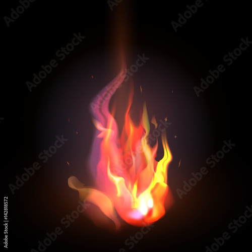 Isolated realistic orange and red fire flame on a dark backgroun