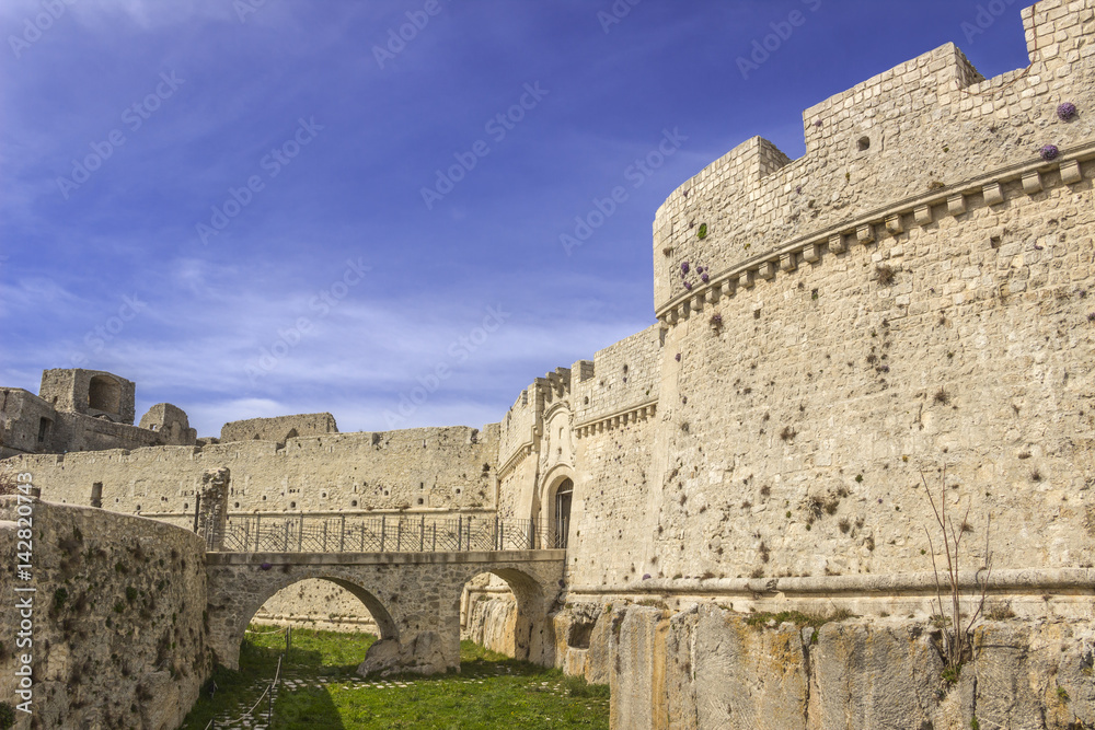 View of the Monte Sant'Angelo Castle.It is an architecture in the Apulian city of Monte Sant'Angelo, Italy (Apulia).The portal is preceded by a bridge with two arches placed across the moat.
