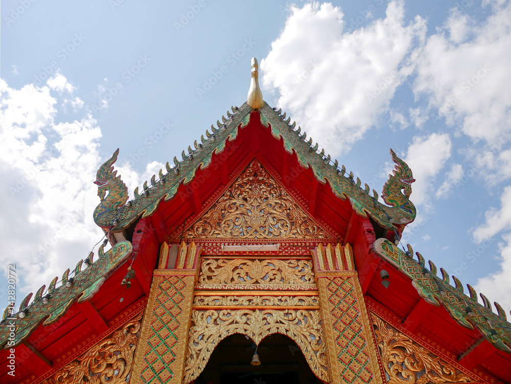 Buddhist temple roof at Wat Phra That Doi Kham (Temple of the Golden Mountain) in Chiang Mai, Thailand