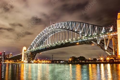 Sydney Harbour night time Panorama with bridge in North Sydney