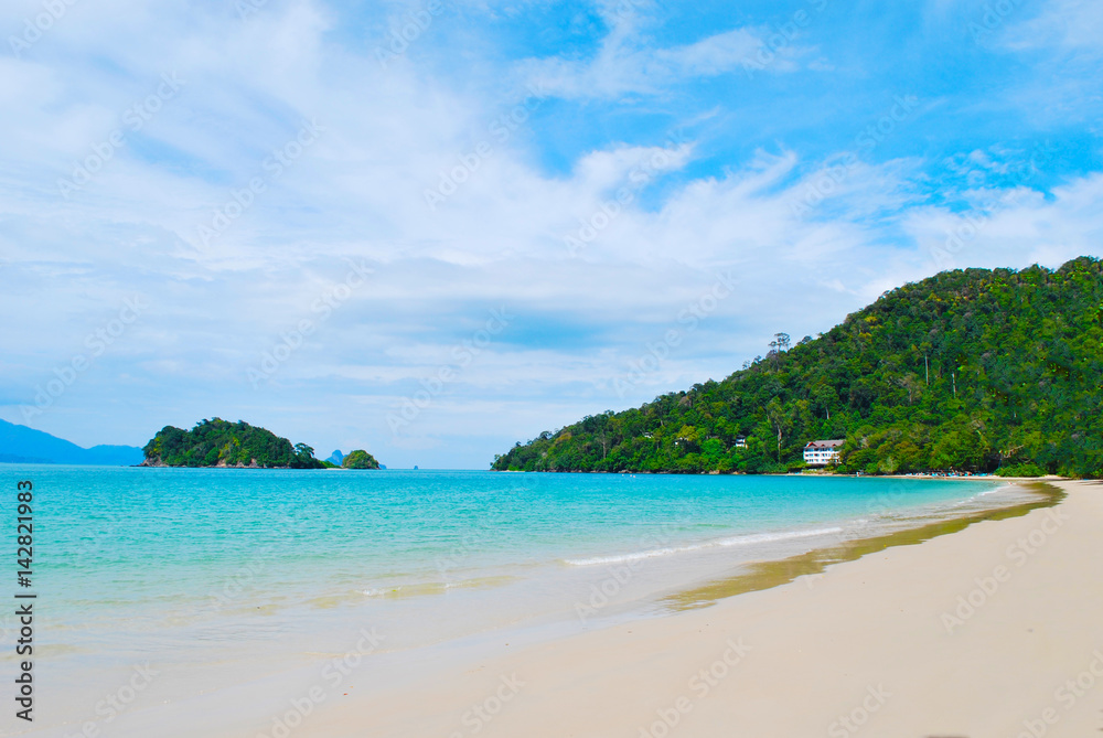 View from a beach in a tropical island, Langkawi in Malaysia : blue sky, blue water and sand.