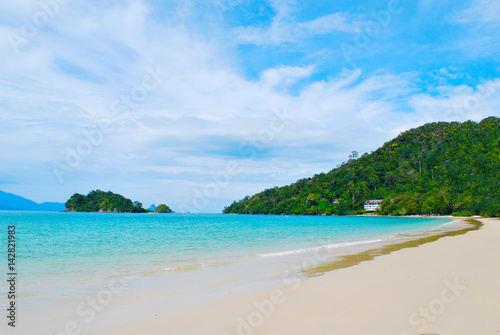 View from a beach in a tropical island, Langkawi in Malaysia : blue sky, blue water and sand.