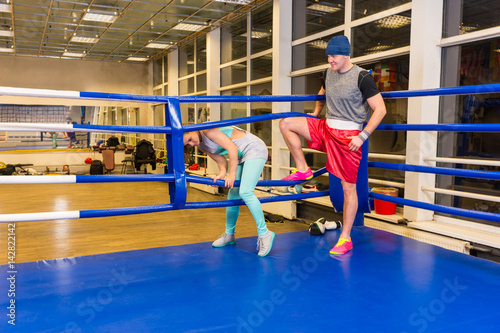 Sporty woman coming in regular boxing ring