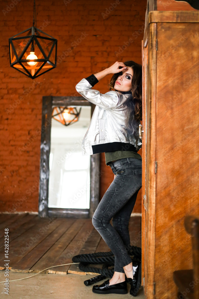 fashion beautiful woman wearing a silver jacket. fashion beautiful woman wearing a silver jacket.