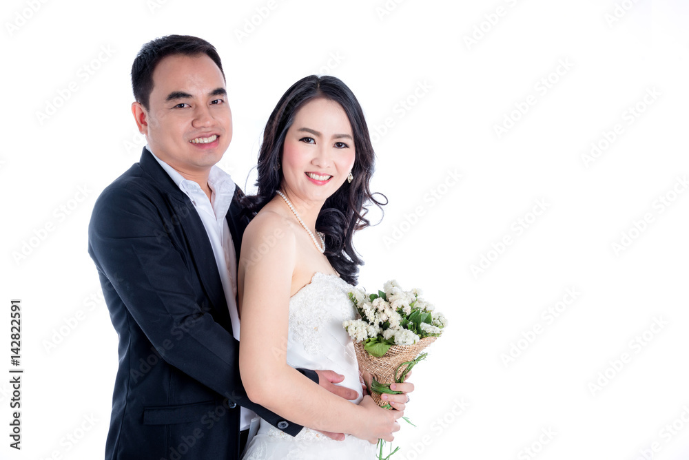 Asian bride and groom isolated over white background Asian bride and groom isolated over white background
