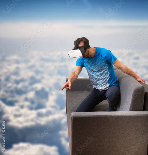 Foto Man wearing virtual reality 3D glasses lives in a virtual world