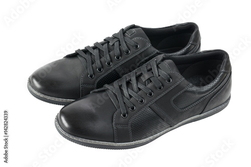 A side view of a pair of black men's shoes for sports.