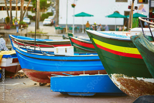 Colorful fishing boats on beach in Camara de Lobos, Madeira