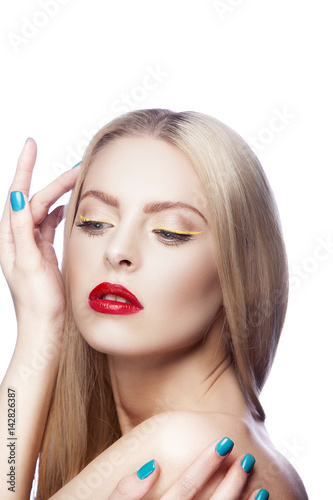 Portrait of beautiful blonde hair woman with bright red lips makeup and yellow arrows. Green nail polish on hands. Isolated on white background