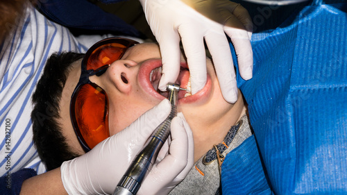 autistic boy in dental treatment. brace. health care