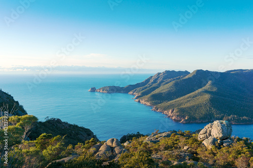 Picturesque seascape of blue ocean lagoon and mountains
