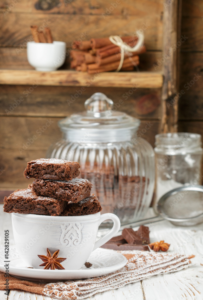 Squares brownie in a white Cup. Chocolate dessert. Traditional dish of American cuisine. Selective focus Squares brownie in a white Cup. Chocolate dessert. Traditional dish of American cuisine. Selective focus