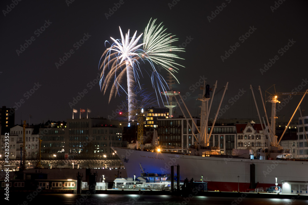 Panorama over the harbour of Hamburg Germany with fireworks