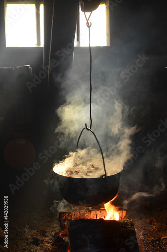 Cooking in a pot over campfire