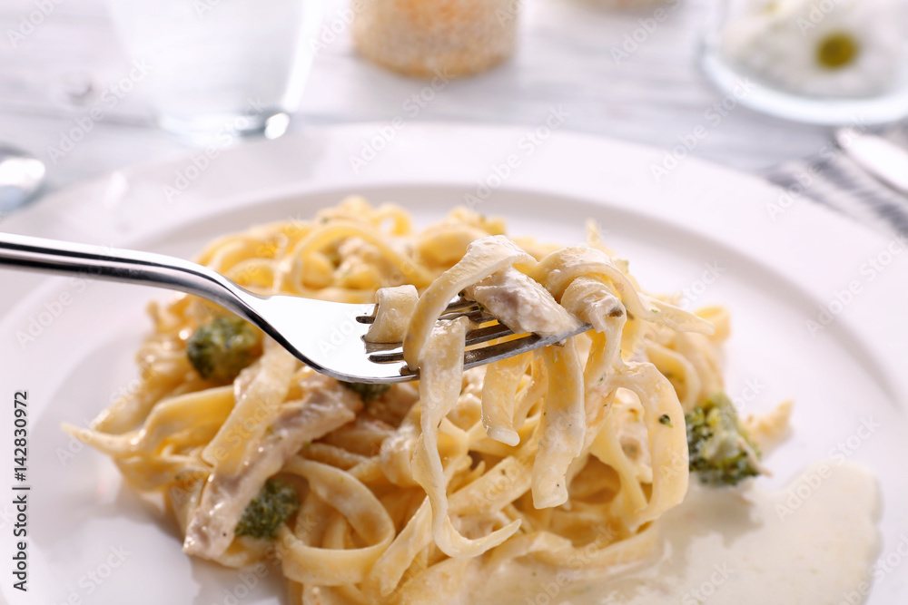 Delicious pasta alfredo with chicken on plate, closeup Delicious pasta alfredo with chicken on plate, closeup