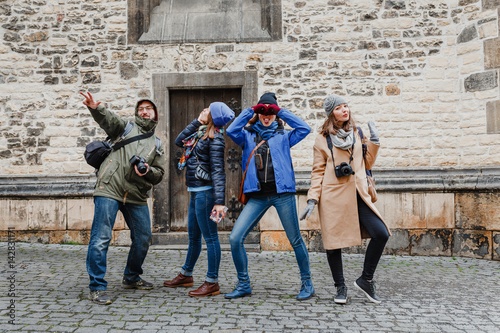 Multi-ethnic Group Of Friends Having Fun In Prague old street