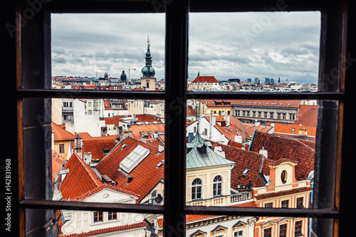 Photography Beautiful View On Prague red roofs from the window of the hotel or restaurant
