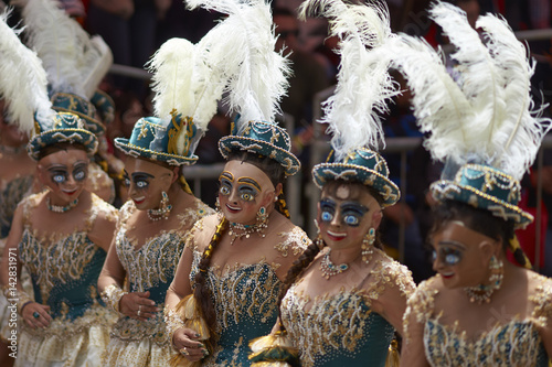 Morenada dancers in ornate costumes parade through the mining city of Oruro on the Altiplano of Bolivia during the annual carnival. photo