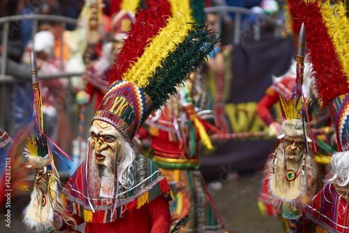 Tobas dancers in colourful costumes performing at the annual Oruro Carnival. The event is designated by UNESCO as being Intangible Cultural Heritage of Humanity.