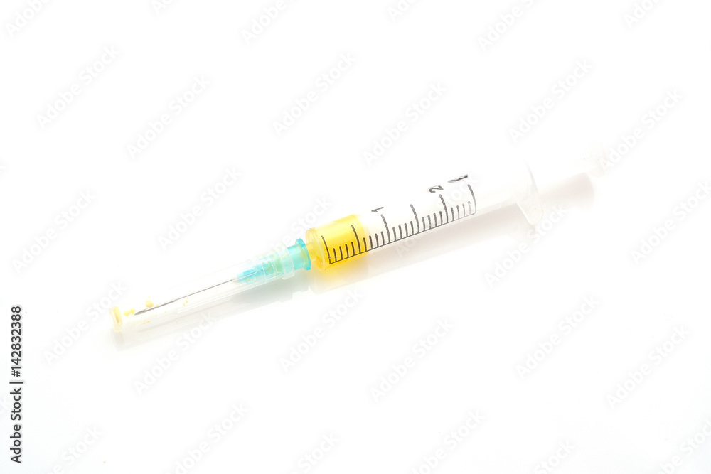 Syringe with yellow liquid isolated on white background. Good photo for your store internet. Syringe with yellow liquid isolated on white background. Good photo for your store internet.