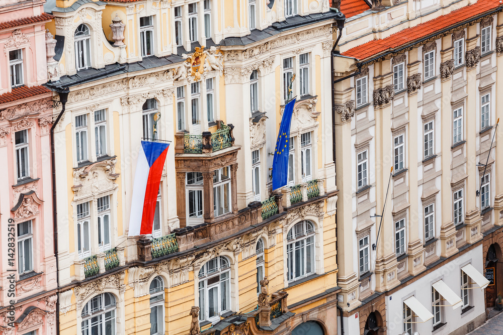 Flags of czech republic and euro union on facade of the house