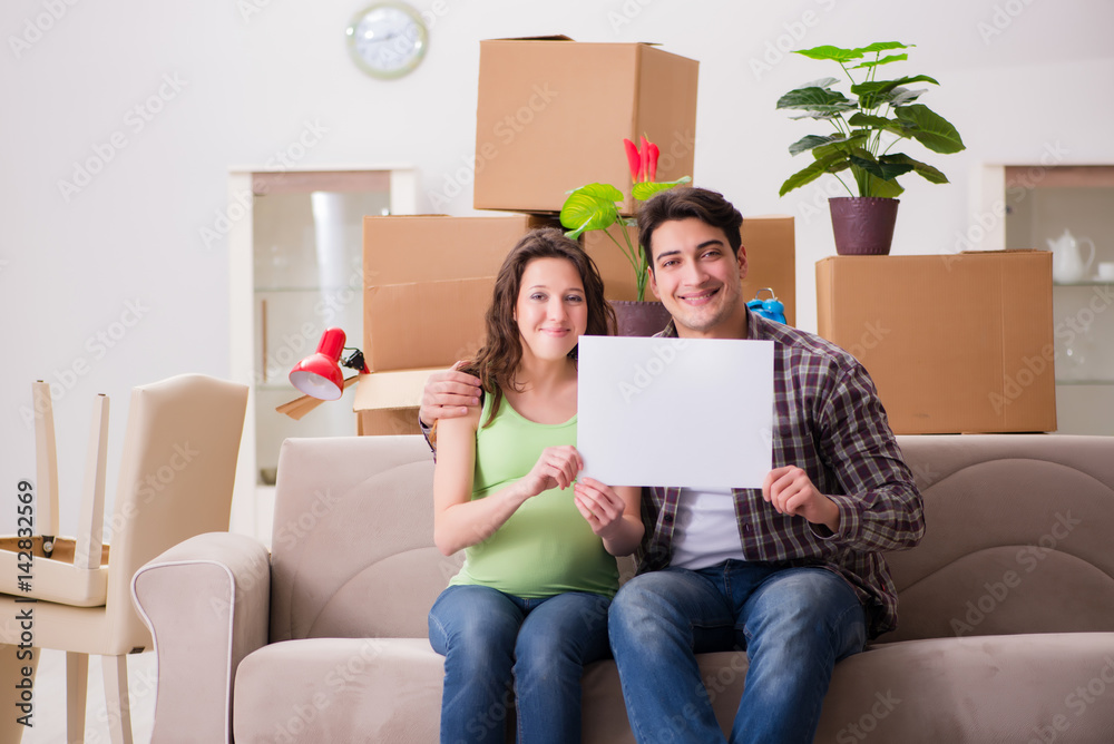 Young couple expecting baby with blank message Young couple expecting baby with blank message