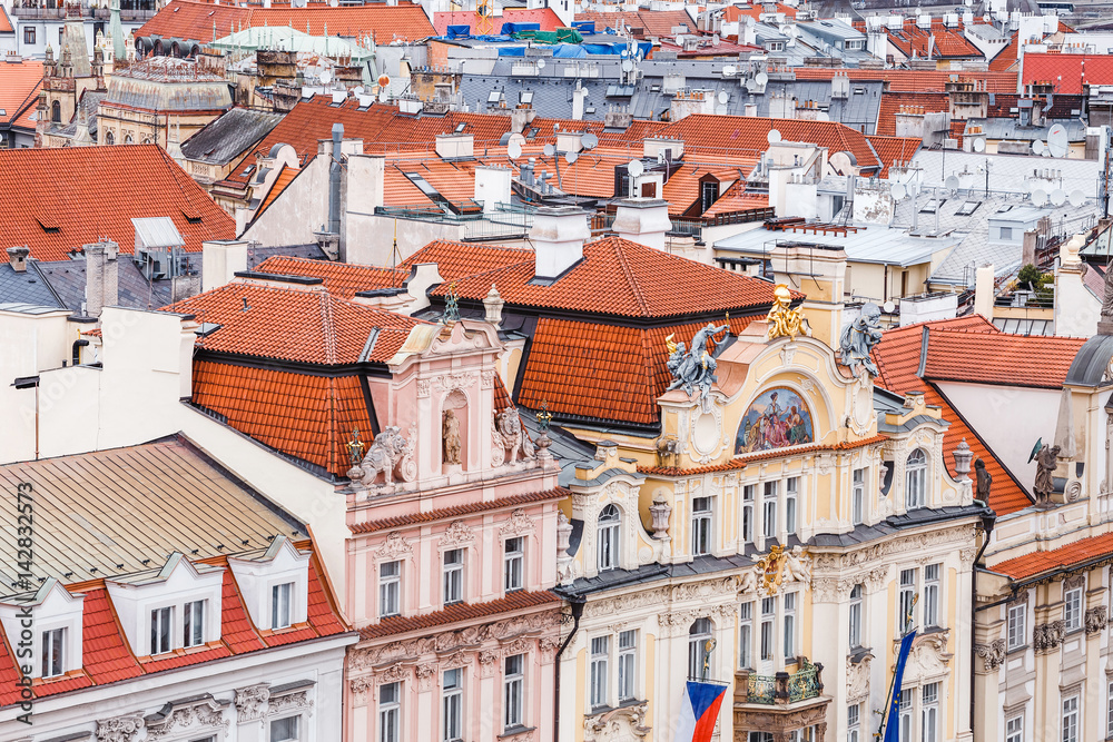 Obraz premium Aerial cityscape view of houses and orange roofs typical of Prague