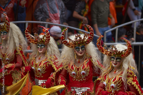 Masked Diablada dancers in ornate costumes parade through the mining city of Oruro on the Altiplano of Bolivia during the annual carnival.