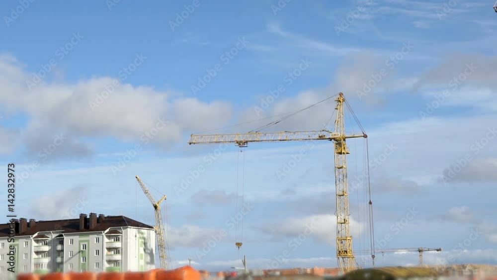 Construction cranes work at construction site of dwelling complex. Timelapse Construction cranes work at construction site of dwelling complex. Timelapse