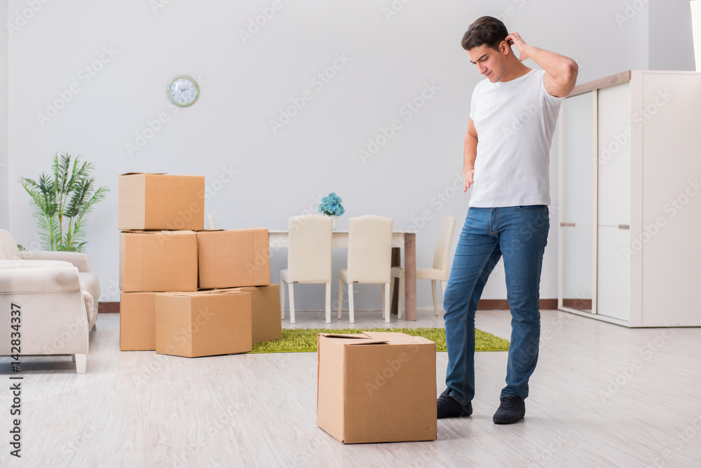 Man caryying boxes at home Man caryying boxes at home