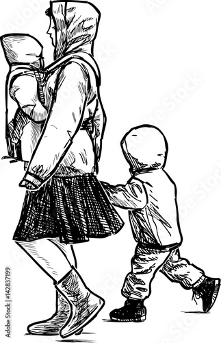 young mother with her kids on a walk
